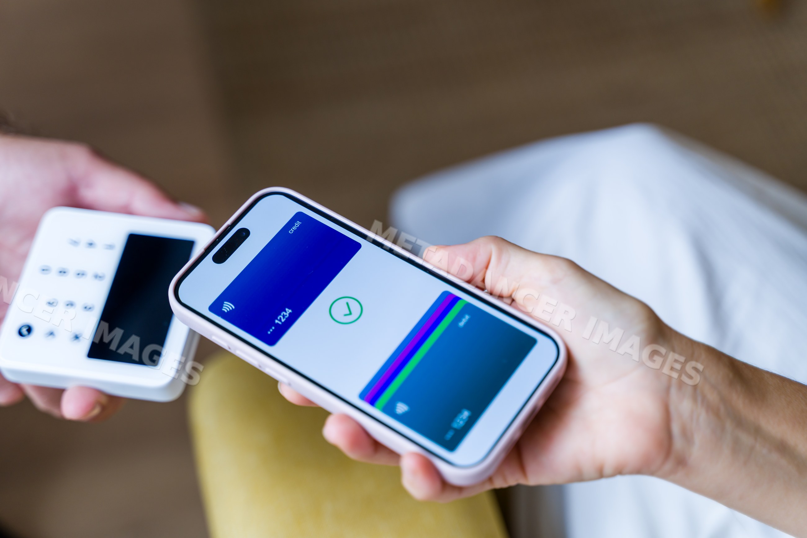Mobile phone making contactless payment with digital wallet