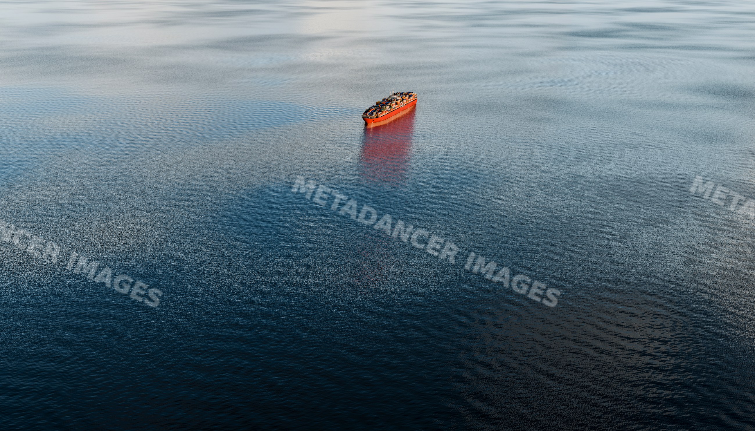 A cargo container ship sails alone on the open ocean