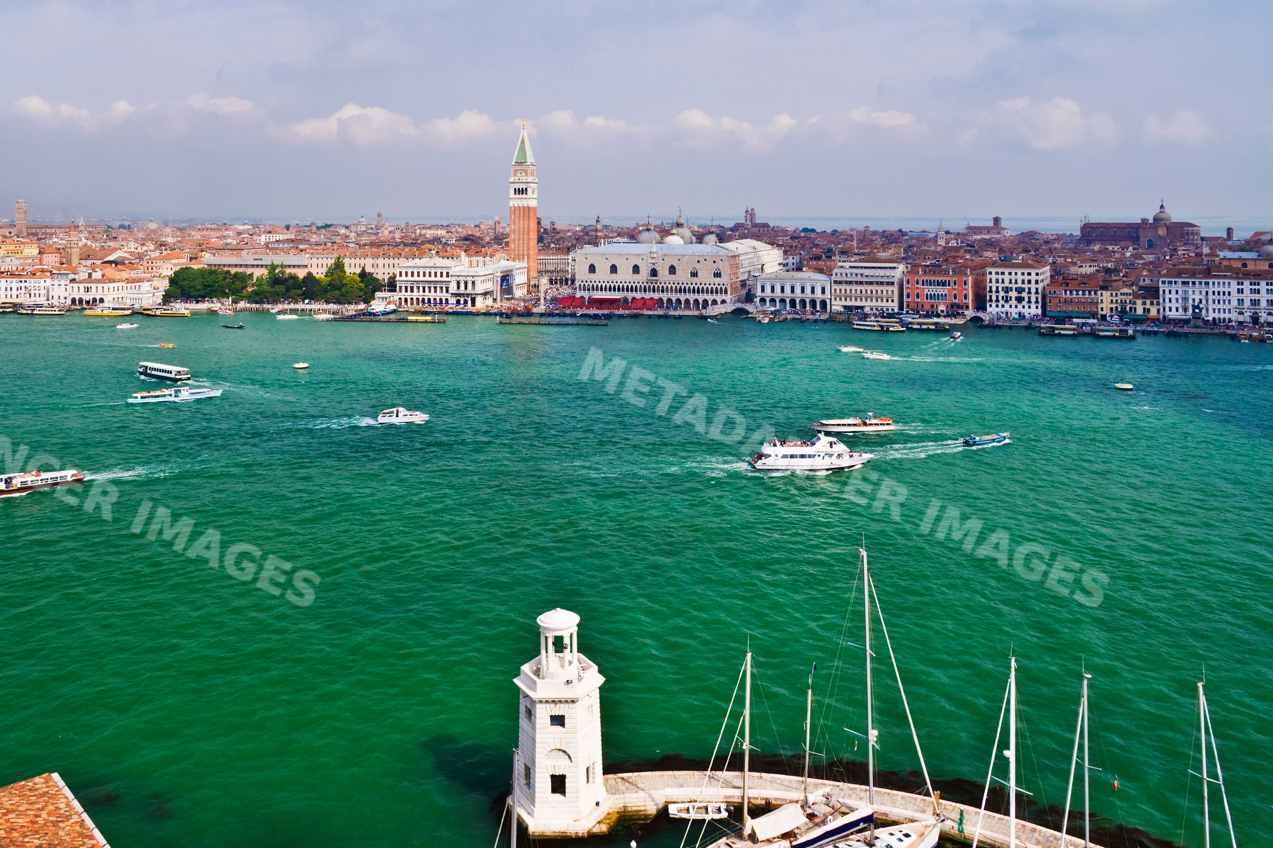 Venice waterfront with boats and historic buildings