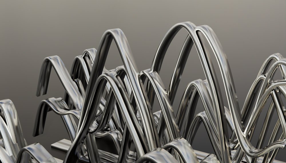 Close-up view of abstract curved metal sculpture with intertwined