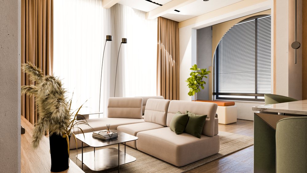 Modern living room with beige sofa and green pillows by large window