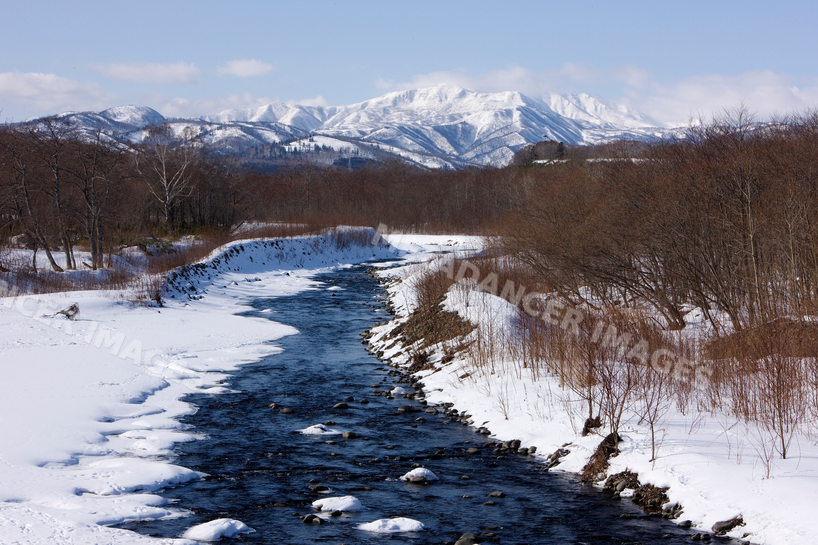 River flowing through snowy winter landscape hokkaido japan