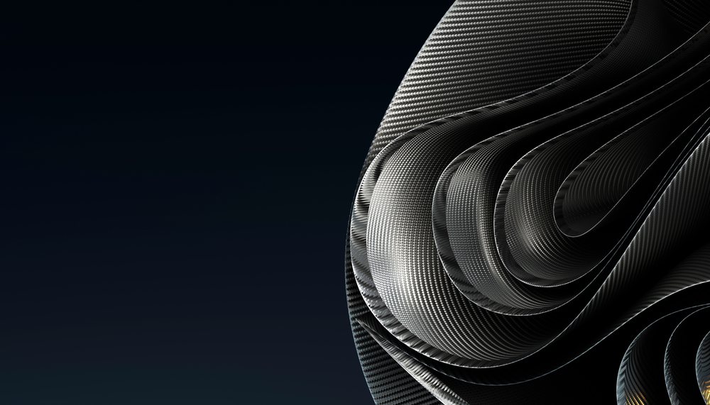 Close-up of twisted carbon fiber fabric with glossy weave texture