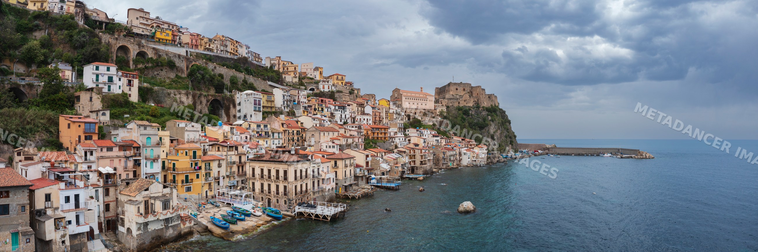 Coastal town of Chianalea with castle and harbor in calabria Italy