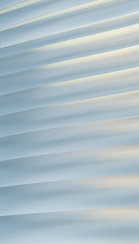 Folded white paper forms layered abstract pattern with soft shadows