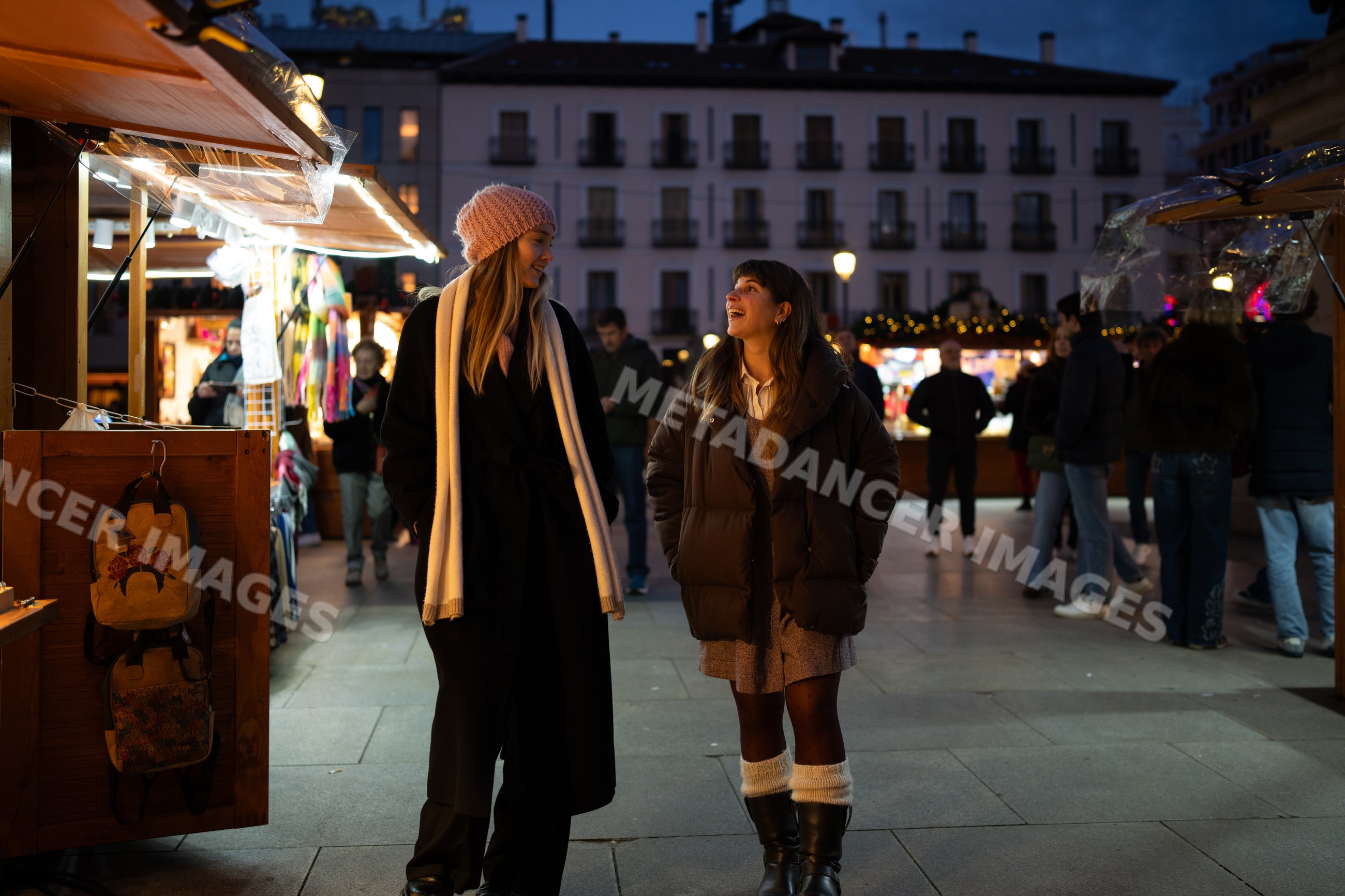 Two white women walking and talking