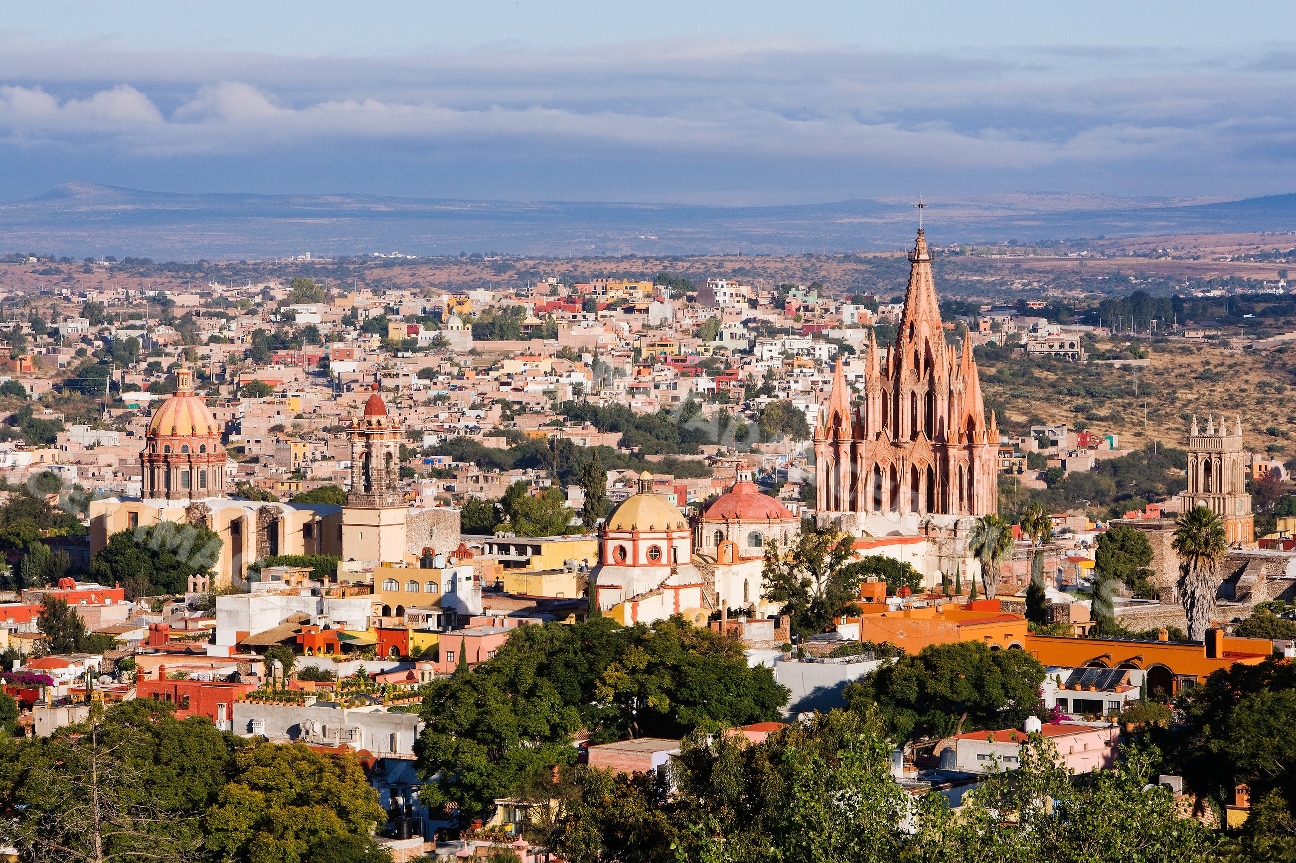 Cityscape of san miguel de allende with historic churches and rooftops