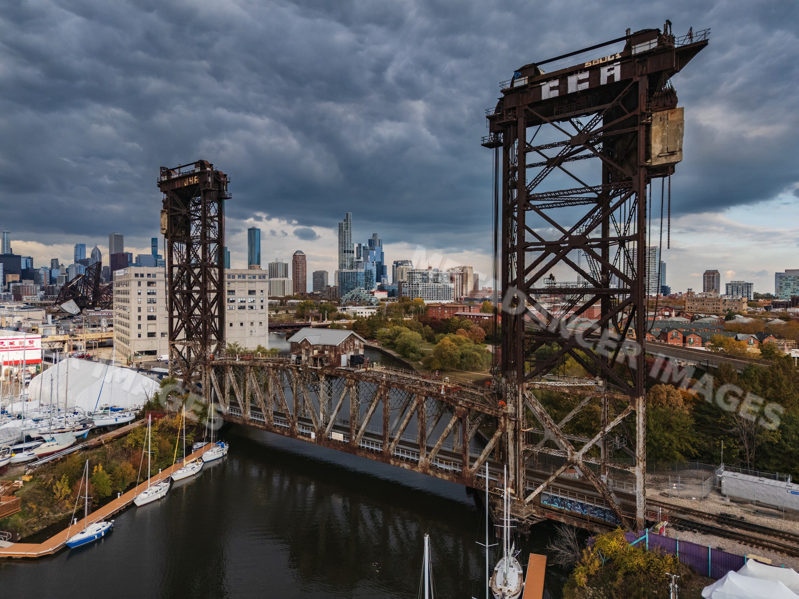 Canal Street Railway Bridge with chicago skyline and boats in river