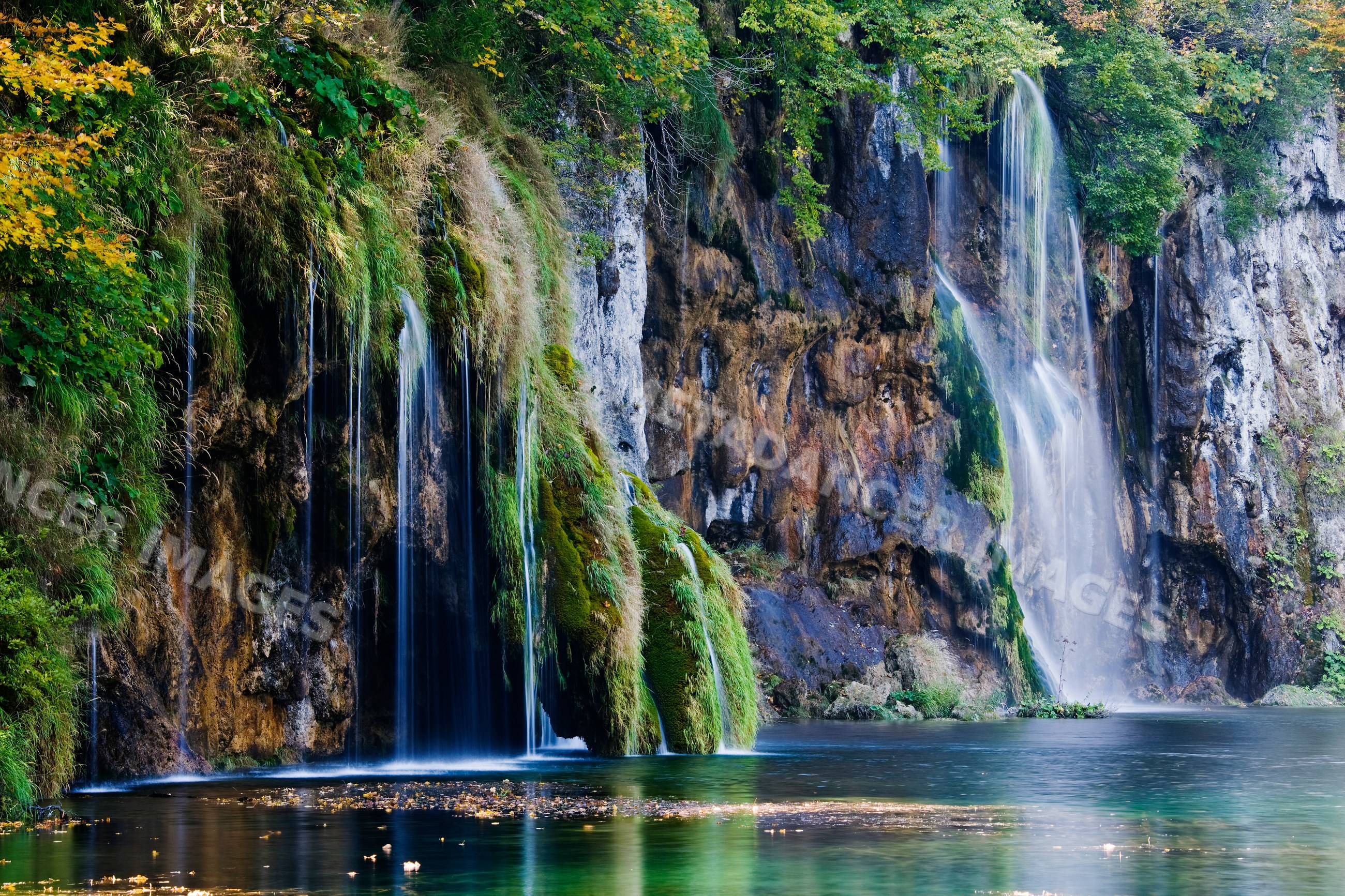 Waterfalls flowing over mossy cliffs croatia
