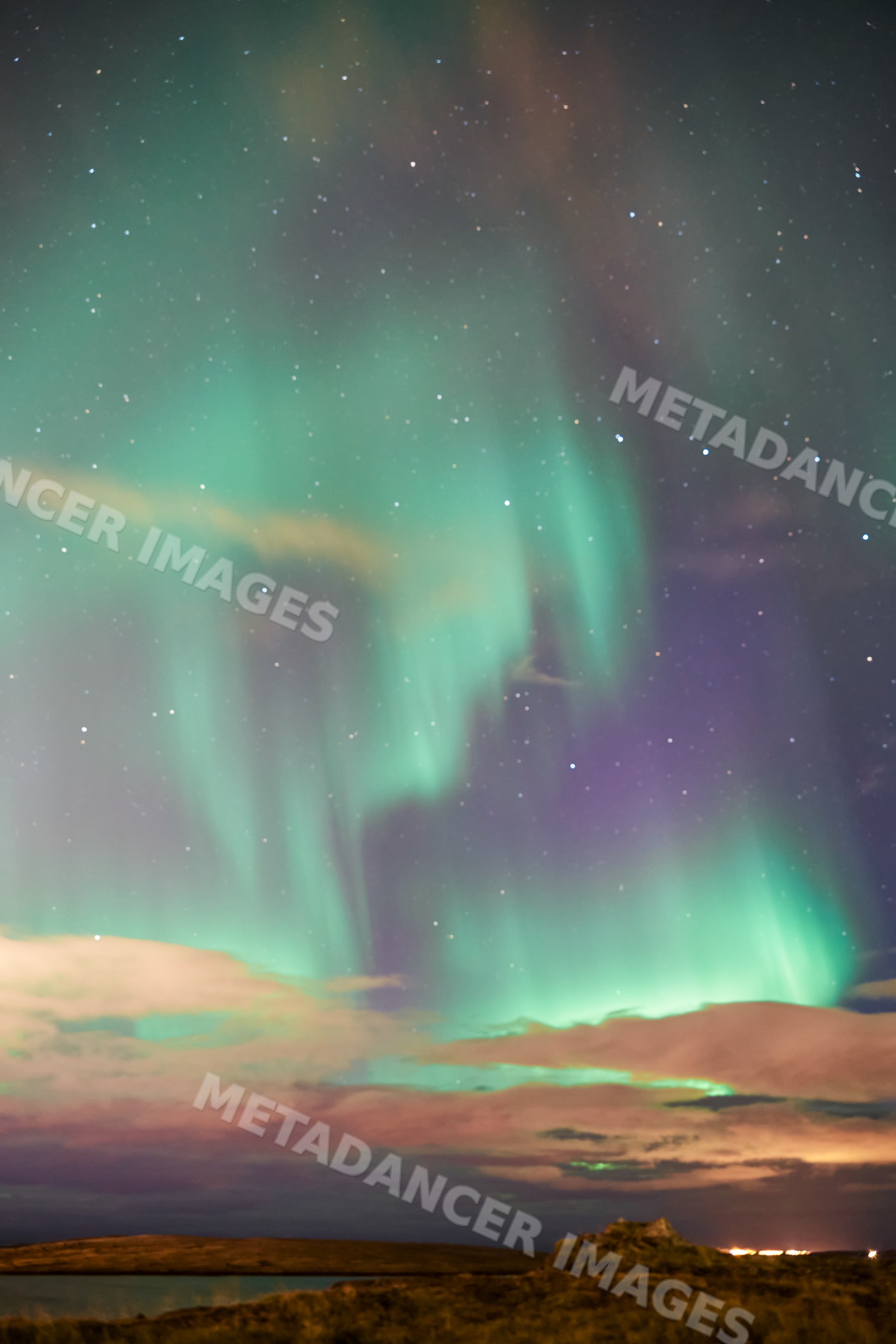Aurora borealis lights up the night sky over Iceland's natural