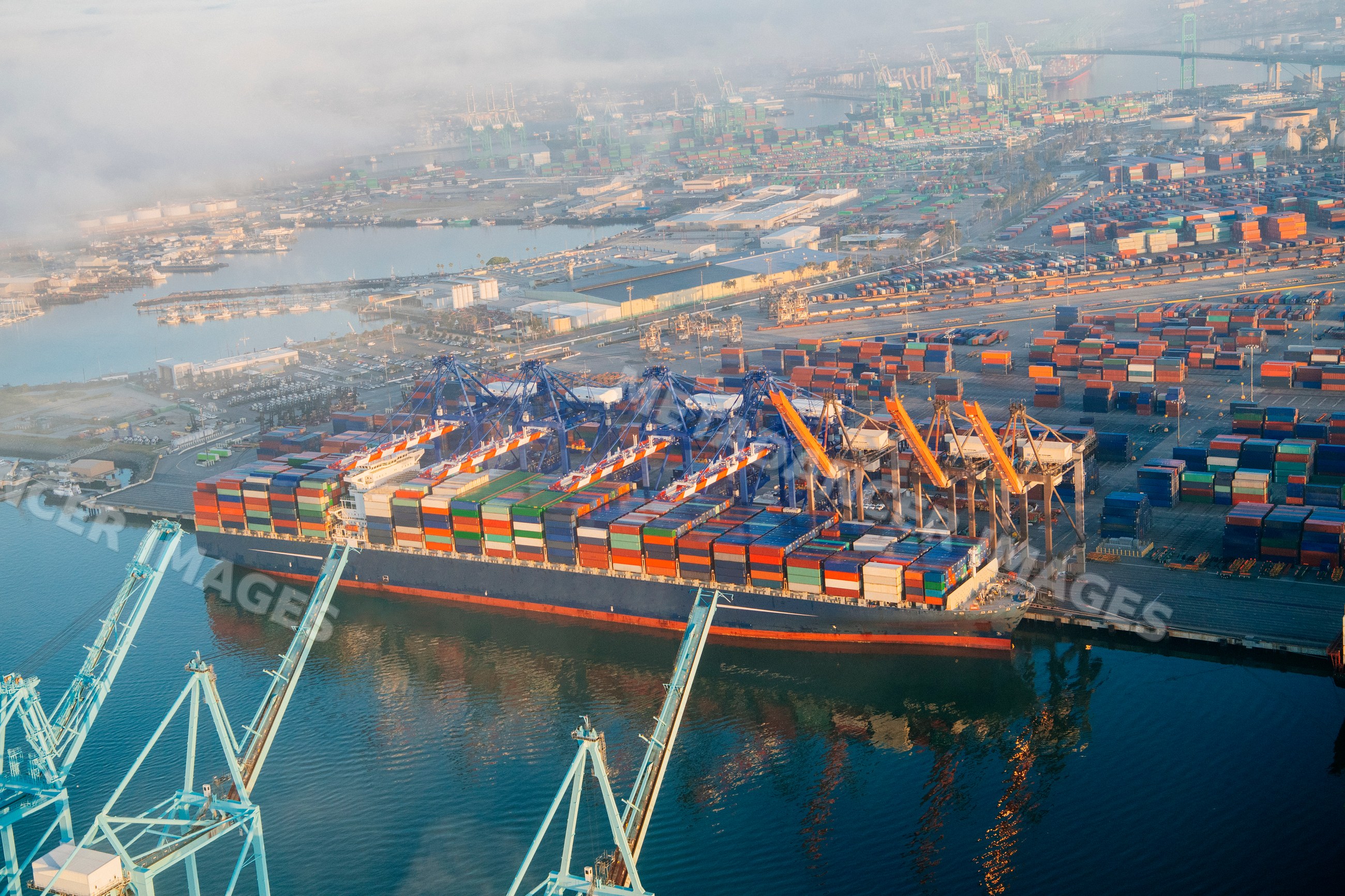 Container ship loaded with shipping containers in a beach