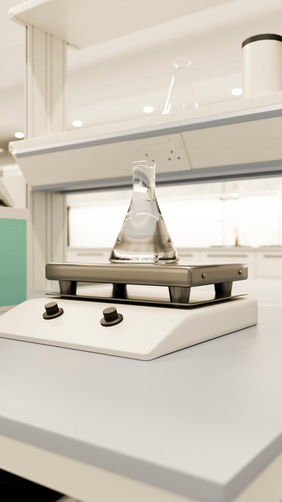 Laboratory hot plate with erlenmeyer flask filled with clear liquid