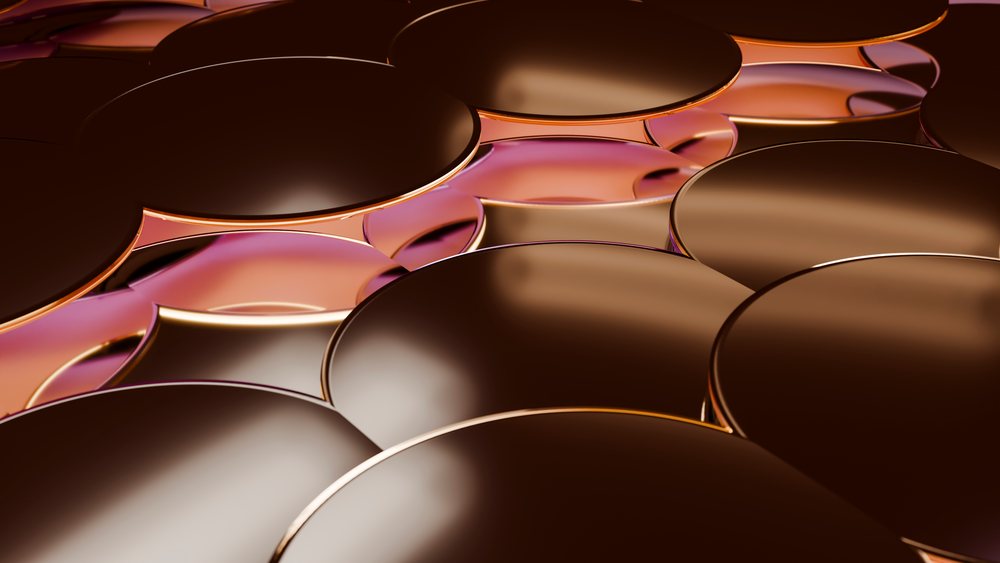 Stacked shiny round metallic disks with reflective surfaces