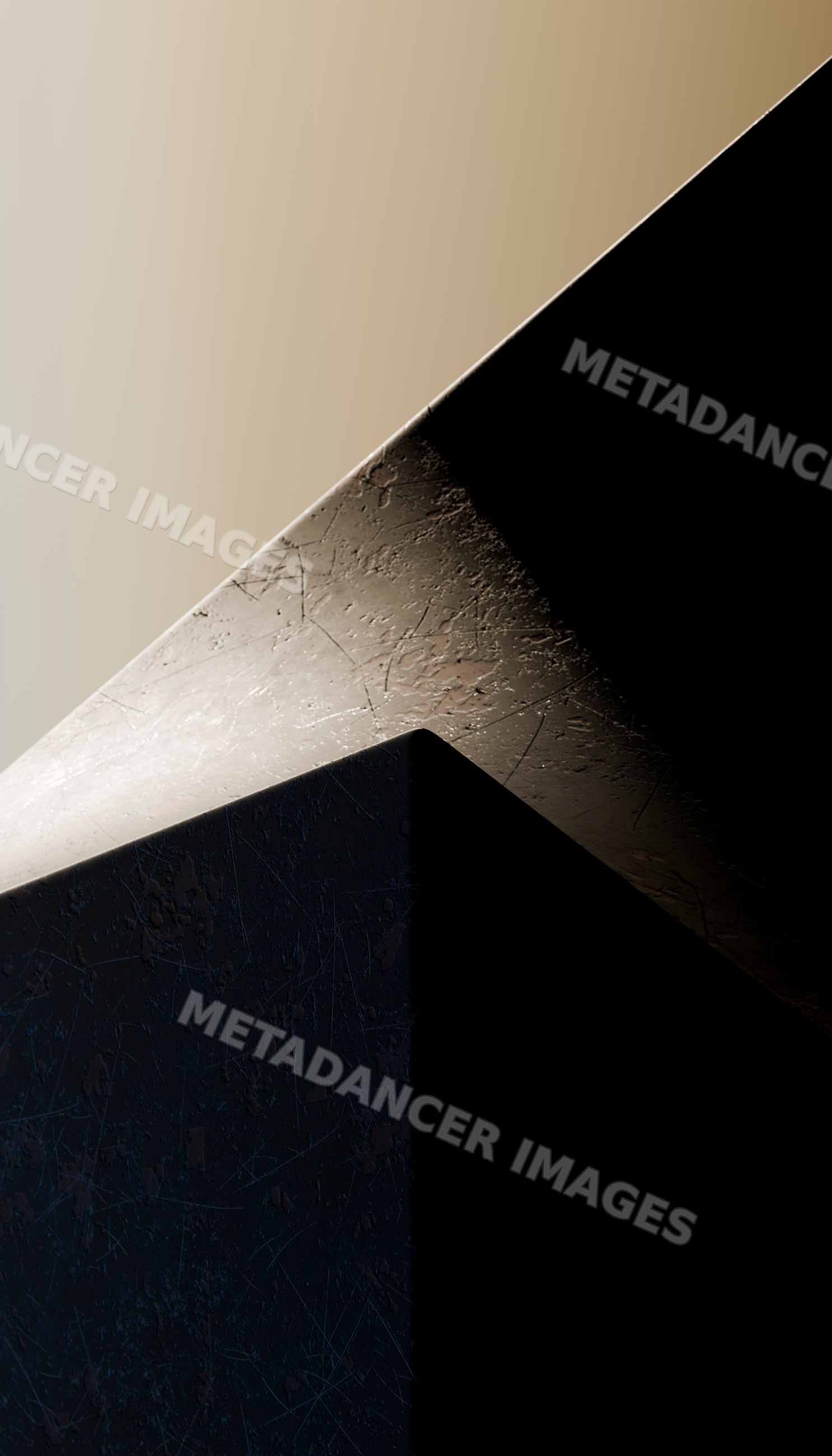 Close-up of scratched metal cube under contrasting light and shadow