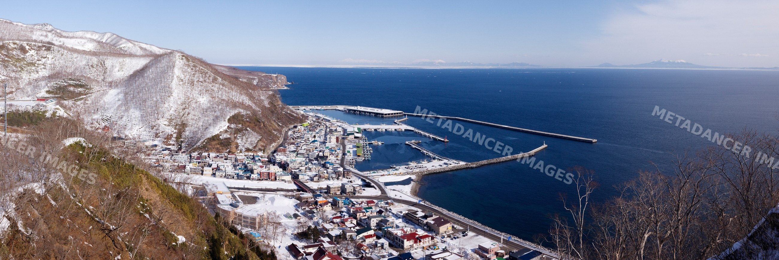 Fishing port on shiretoko peninsula in snowy hokkaido, japan