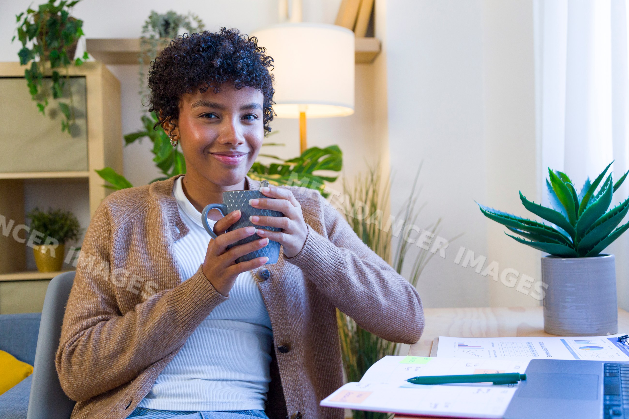 Young African American woman enjoying a hot beverage