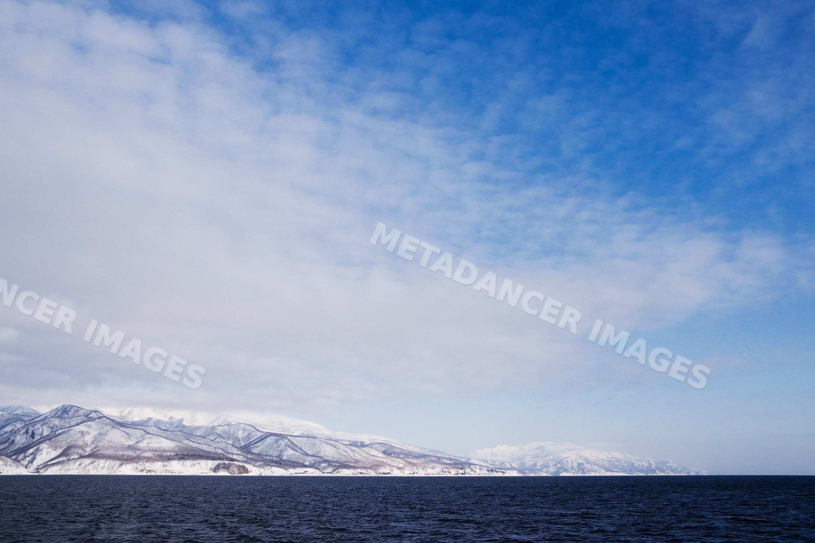 Shiretoko peninsula snow-covered mountains along nemuro channel Japan