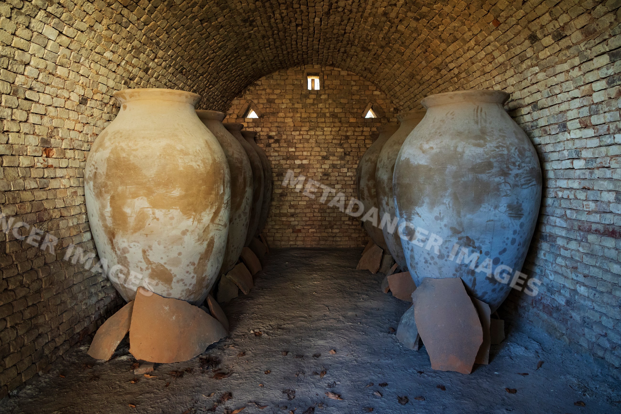 Qvevri wine vessels staged inside brick kiln in Georgia