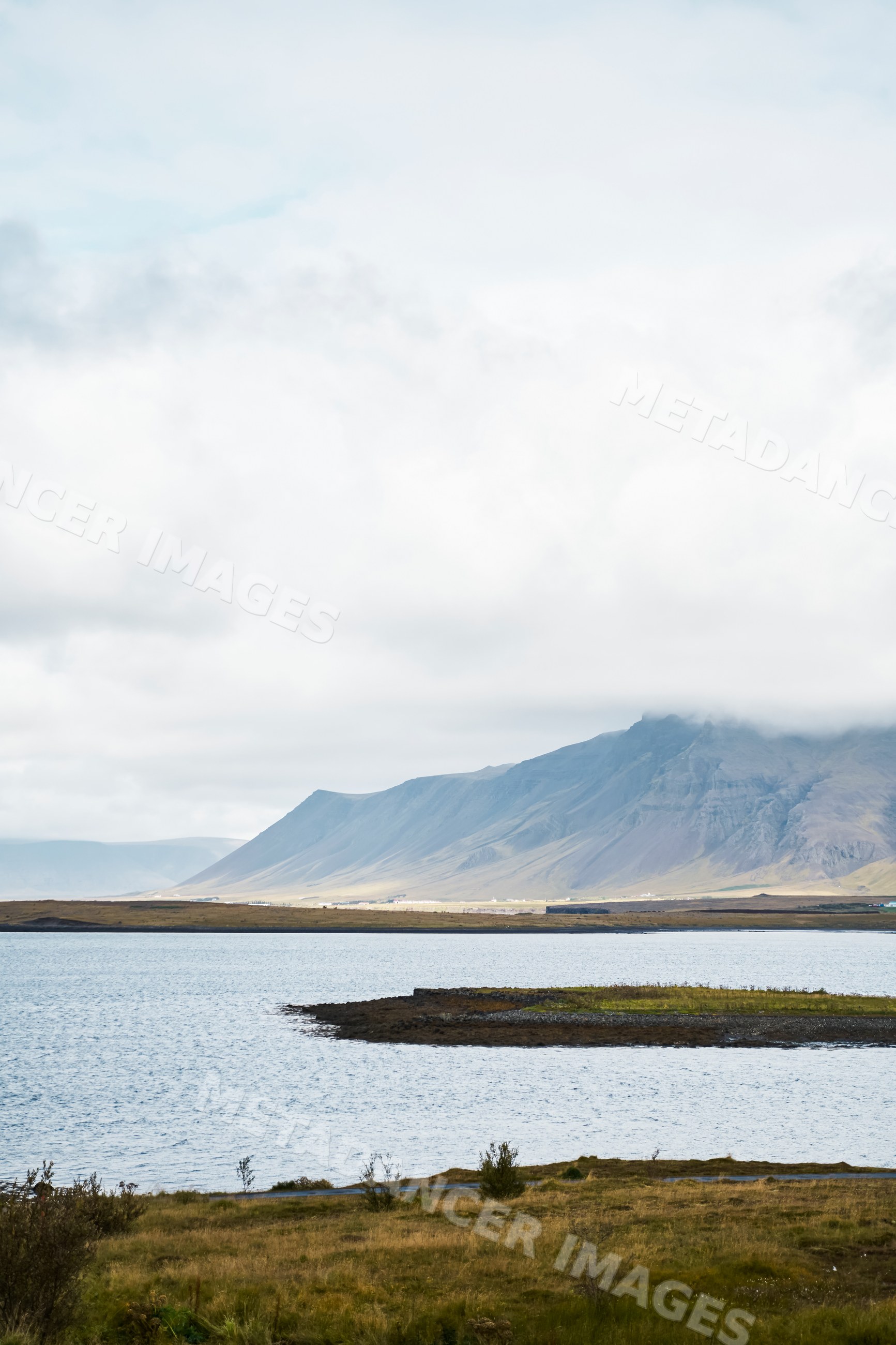 Mountain and lake landscape with clouds