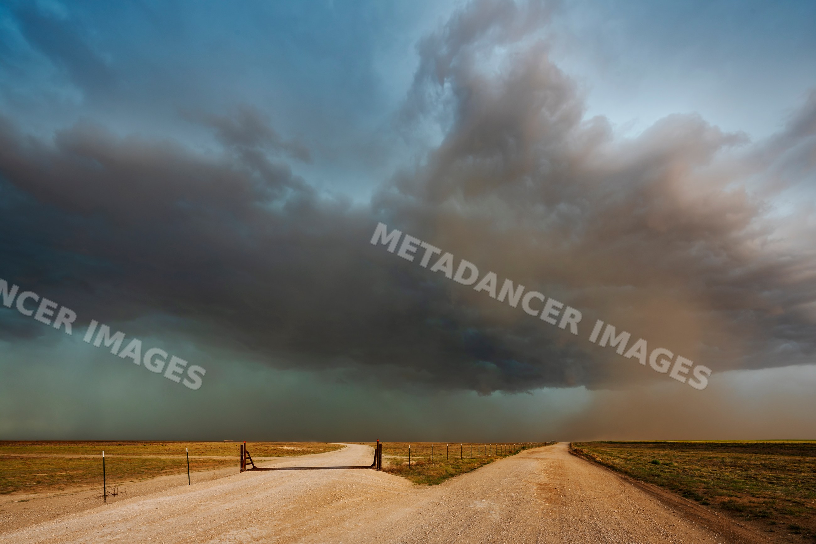 Storm Cell and Dust Cloud over dirt roads in dalhart, texas