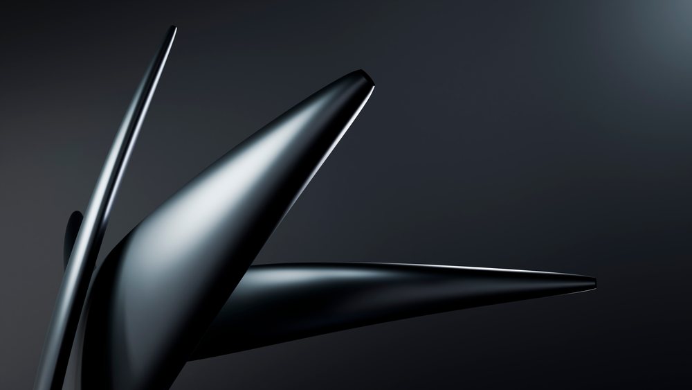 Black curved metal sculpture in modern art setting