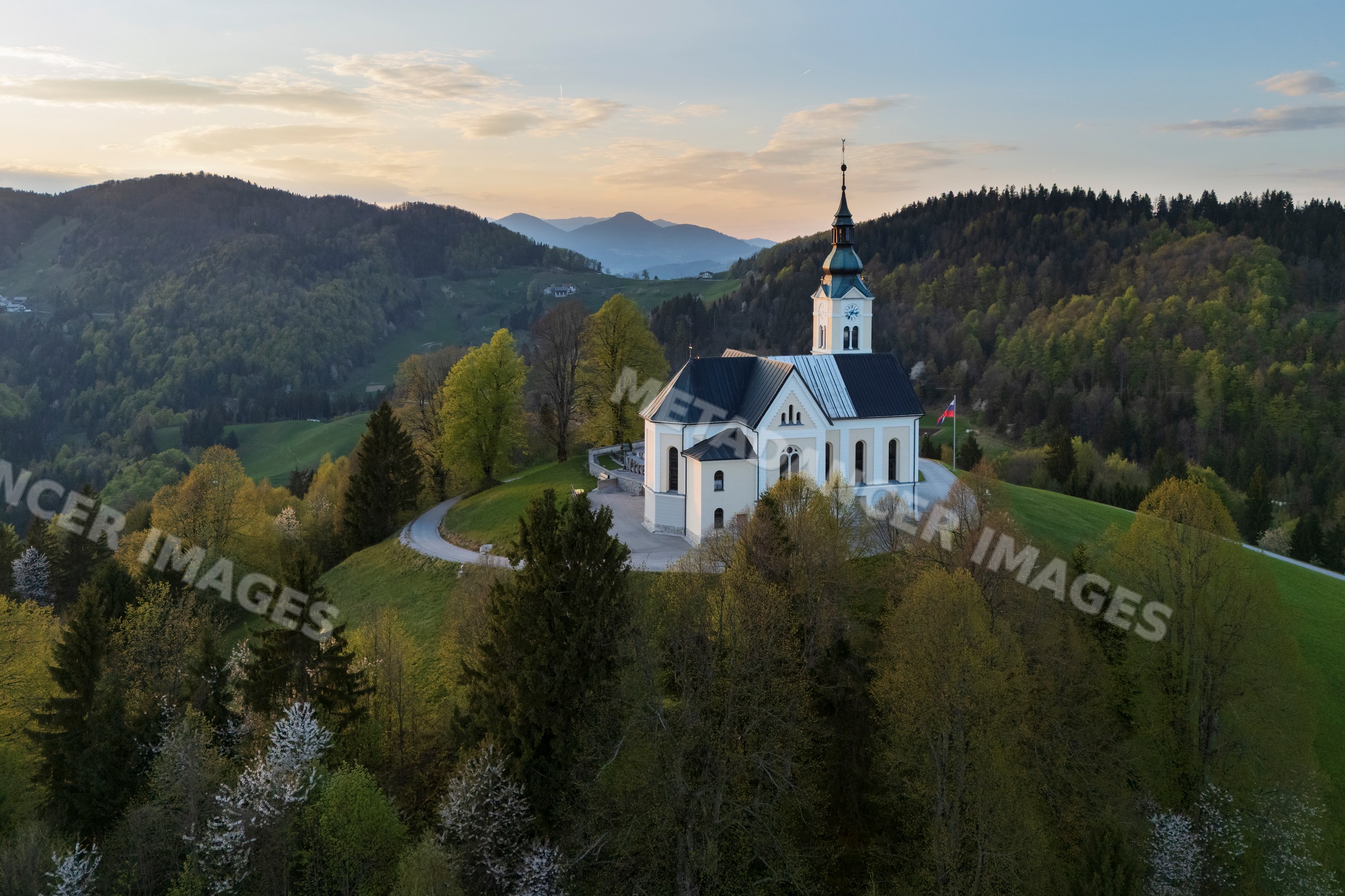 Parish church of st. leonard atop hill with rolling hills in a church