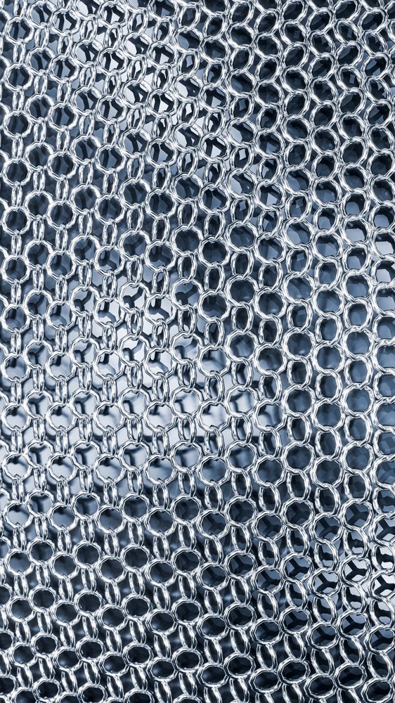 Metal chainmail fabric with interlinked steel rings forming protective