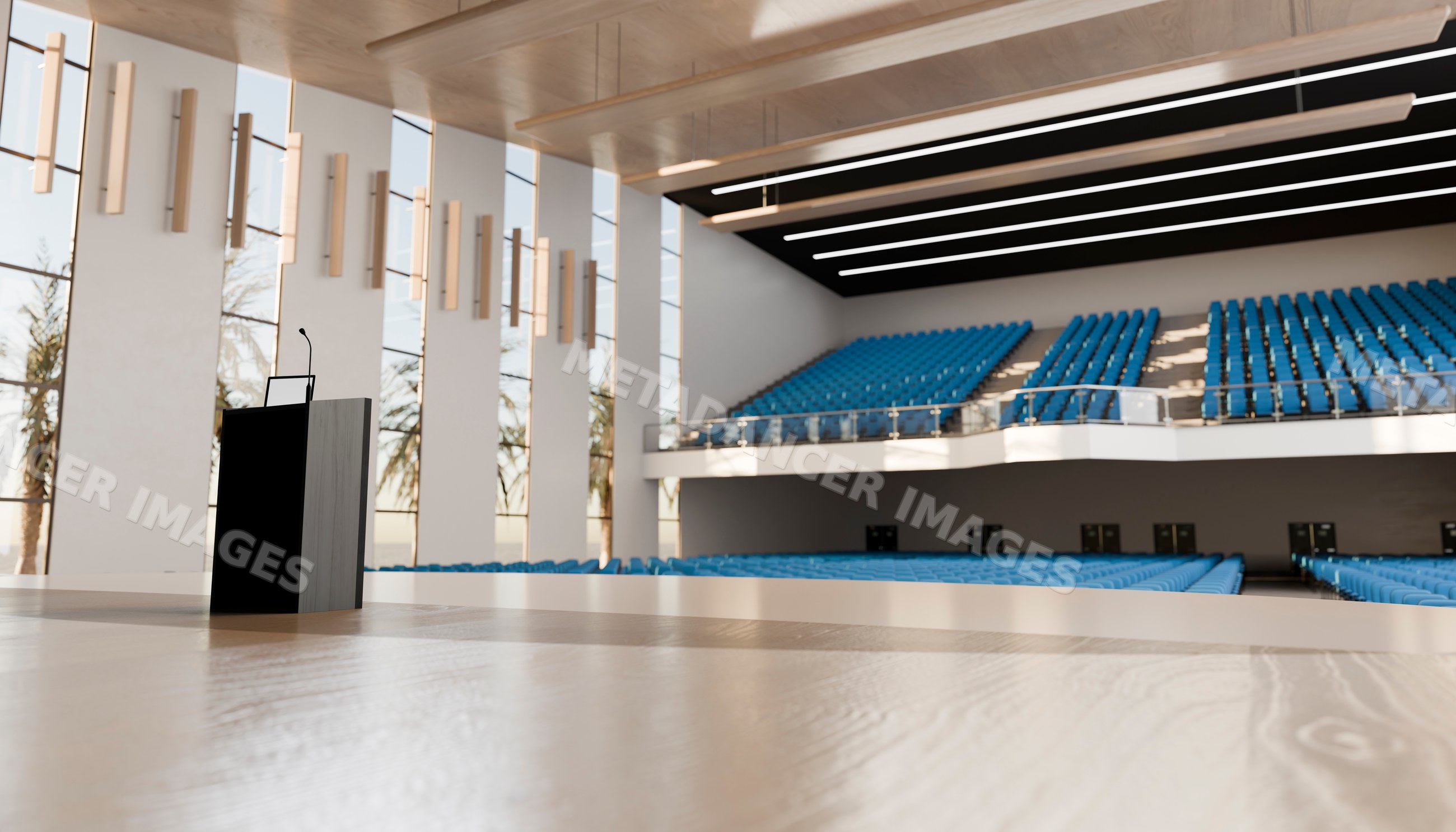 Lecture hall with podium and blue auditorium seating