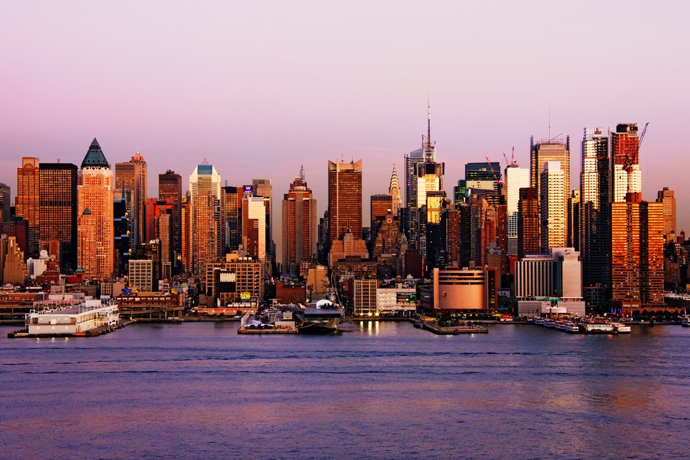 Midtown manhattan skyline at dusk along the hudson river