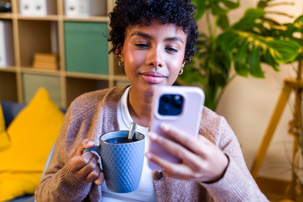 African American woman drinking coffee