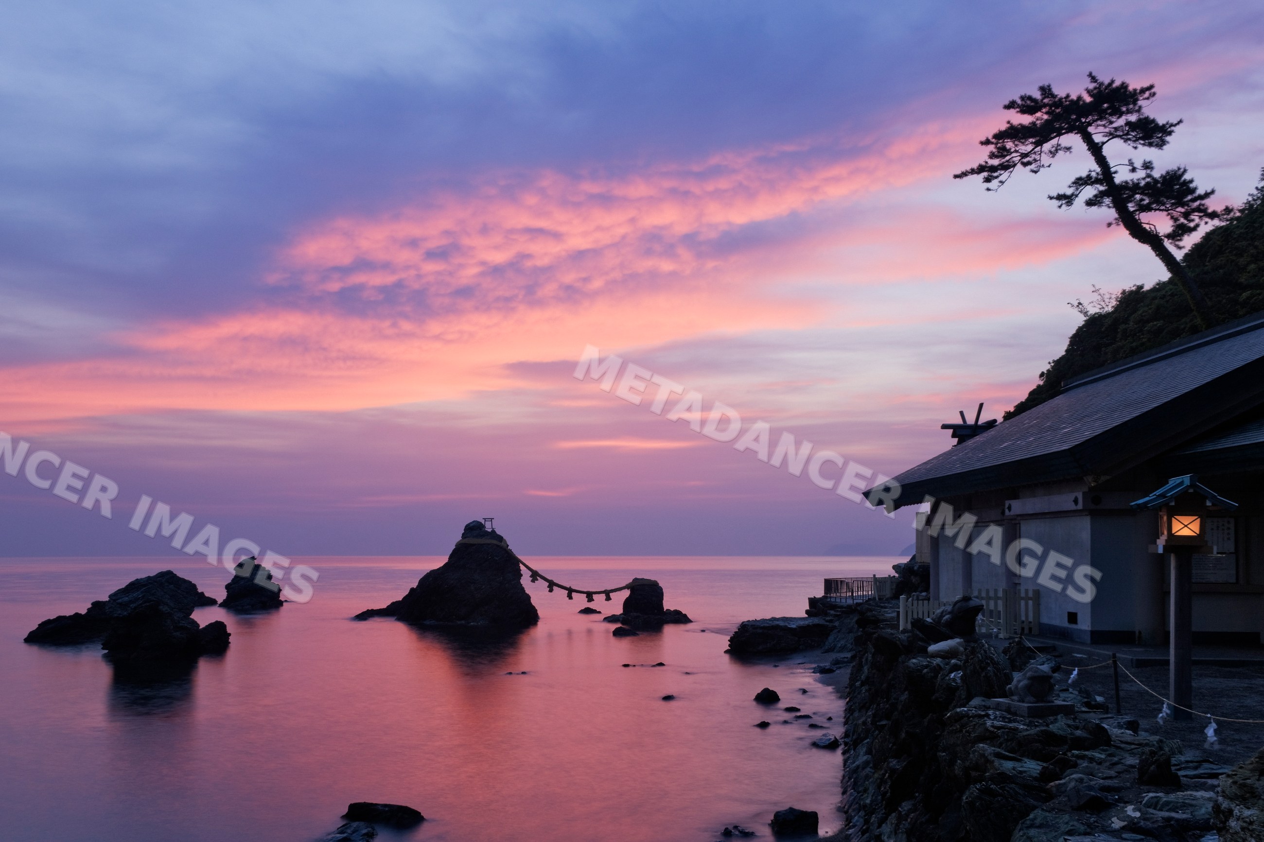 Meoto iwa sacred rocks and shinto shrine at sunset in kansai, japan