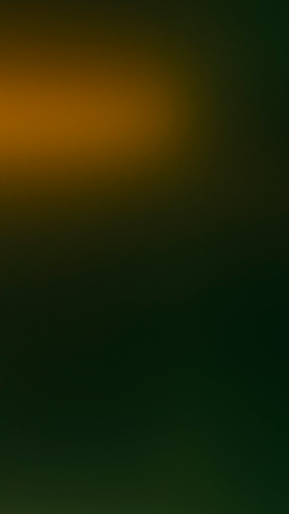 Abstract dark green and orange glowing gradient background