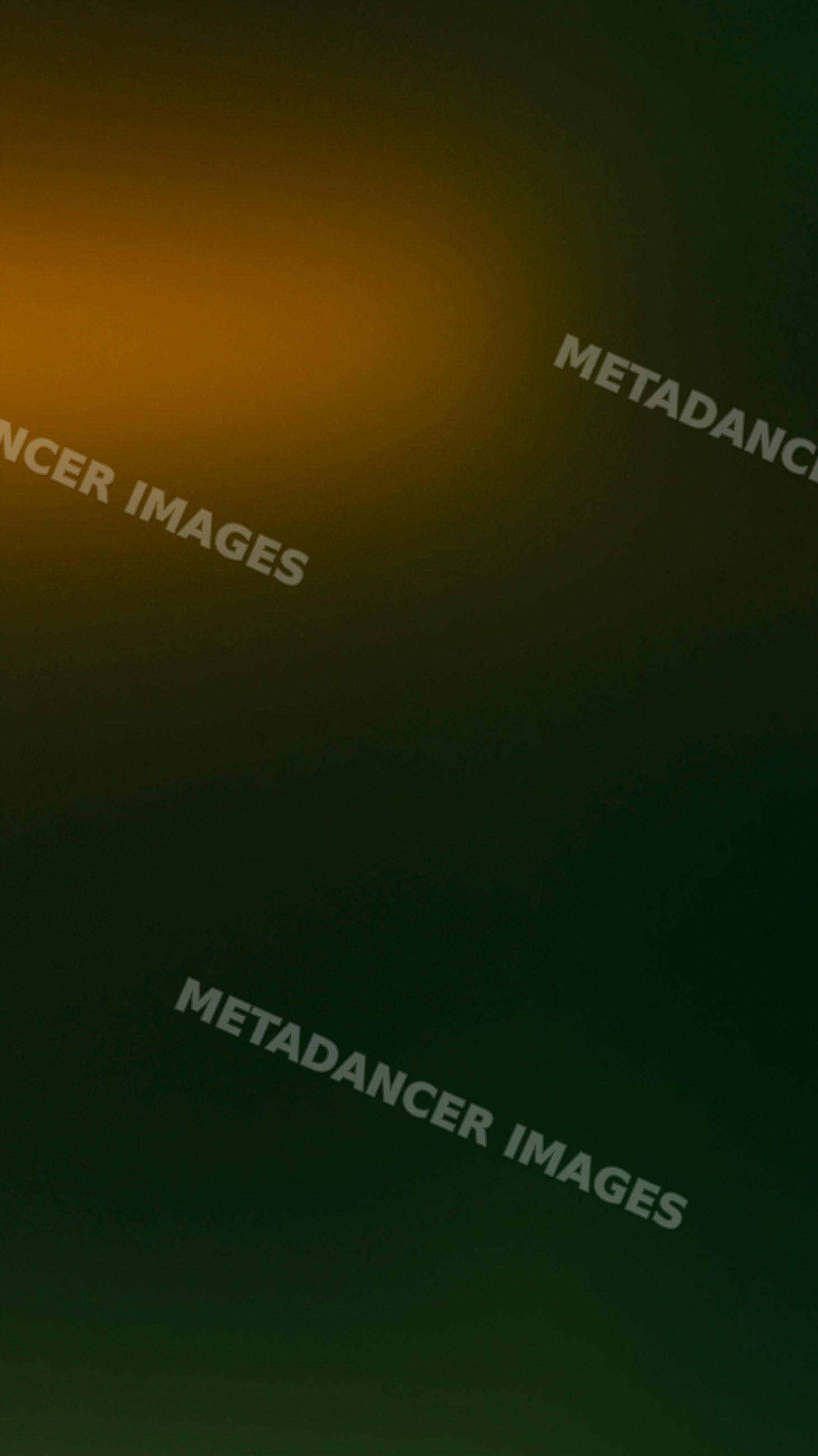 Abstract dark green and orange glowing gradient background