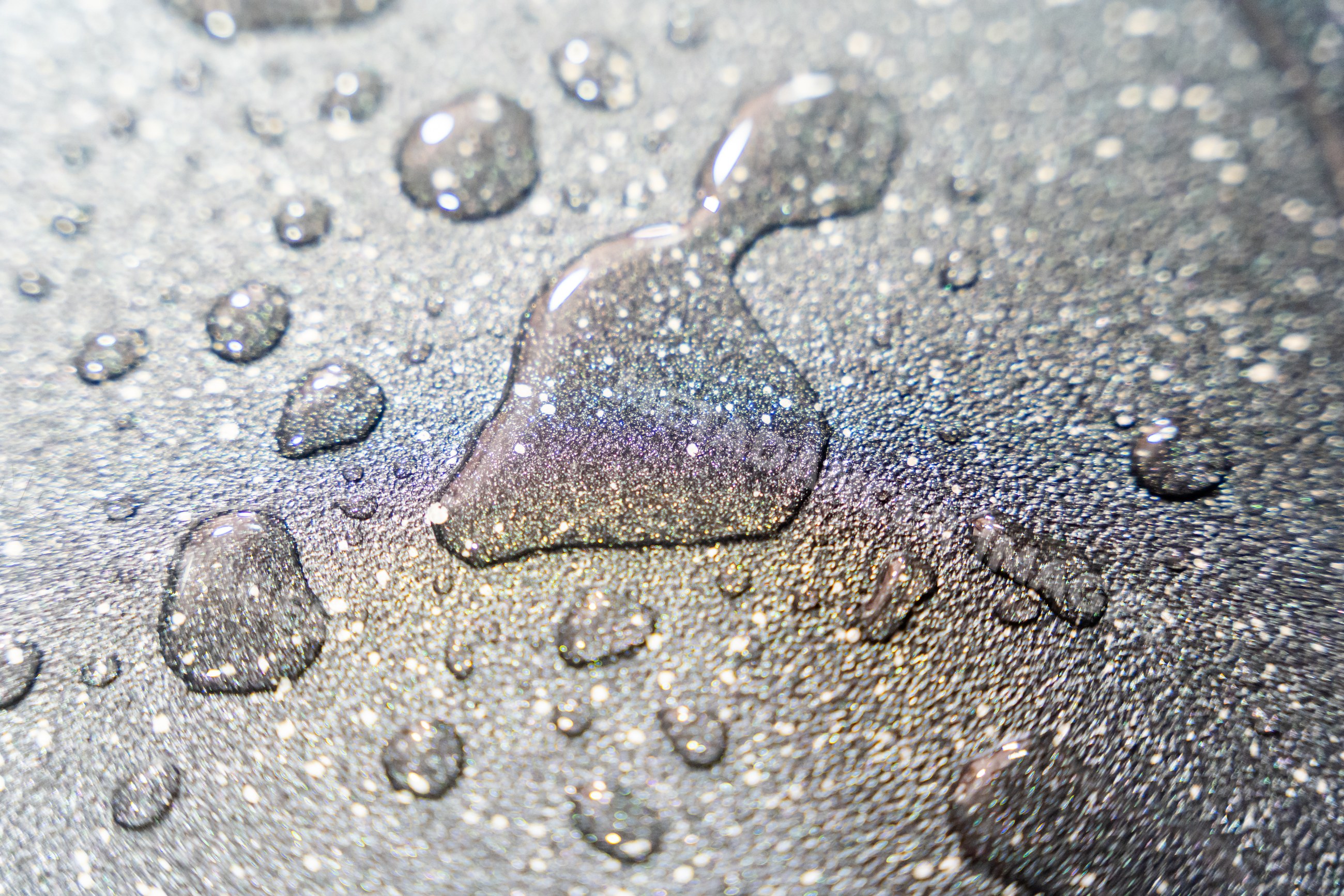 Water droplets creating a sparkling textured surface background