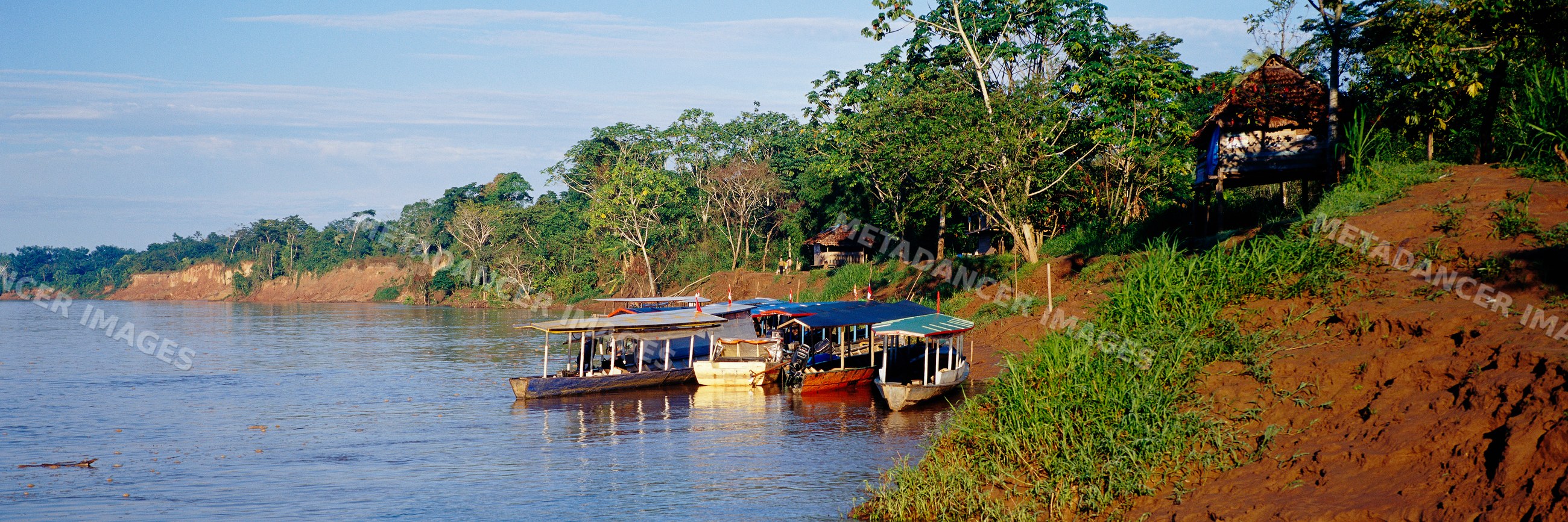 Boat launch with vessels along river