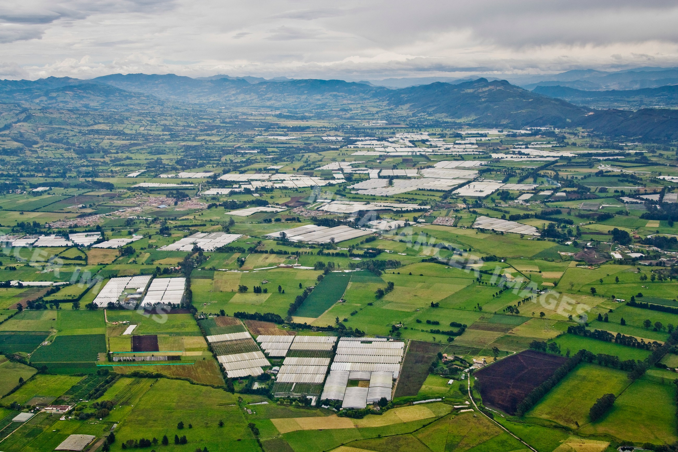 Aerial view of farmland with greenhouses near bogota colombia