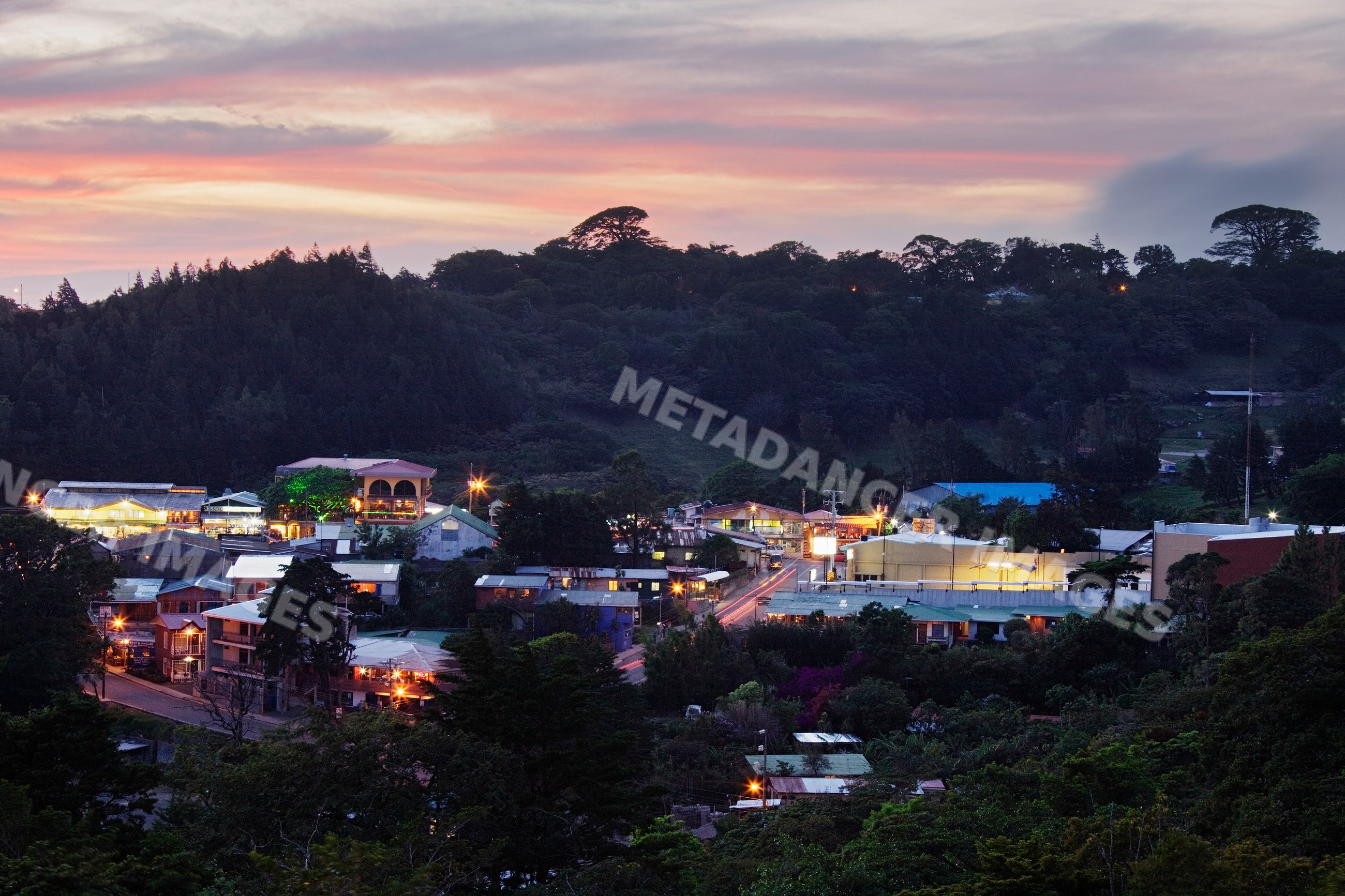 Sunset view over santa elena village nestled in forested hills