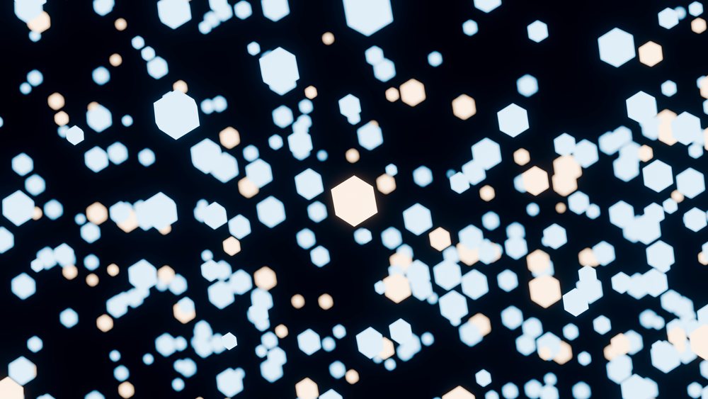 Glowing blue and white hexagon shapes on dark background