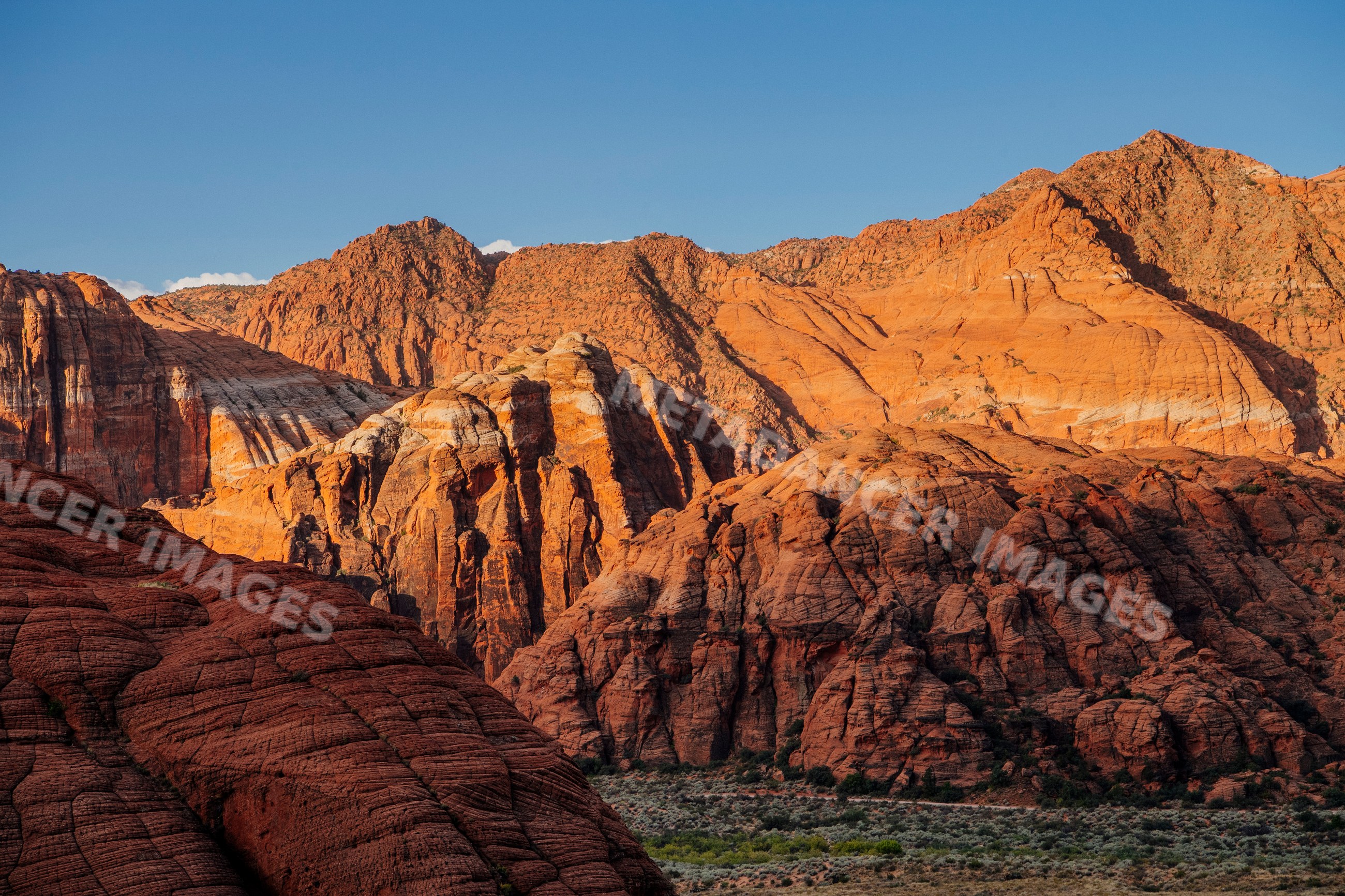Red cliffs and rugged desert rock formations
