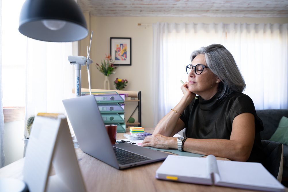 White woman with gray hair working