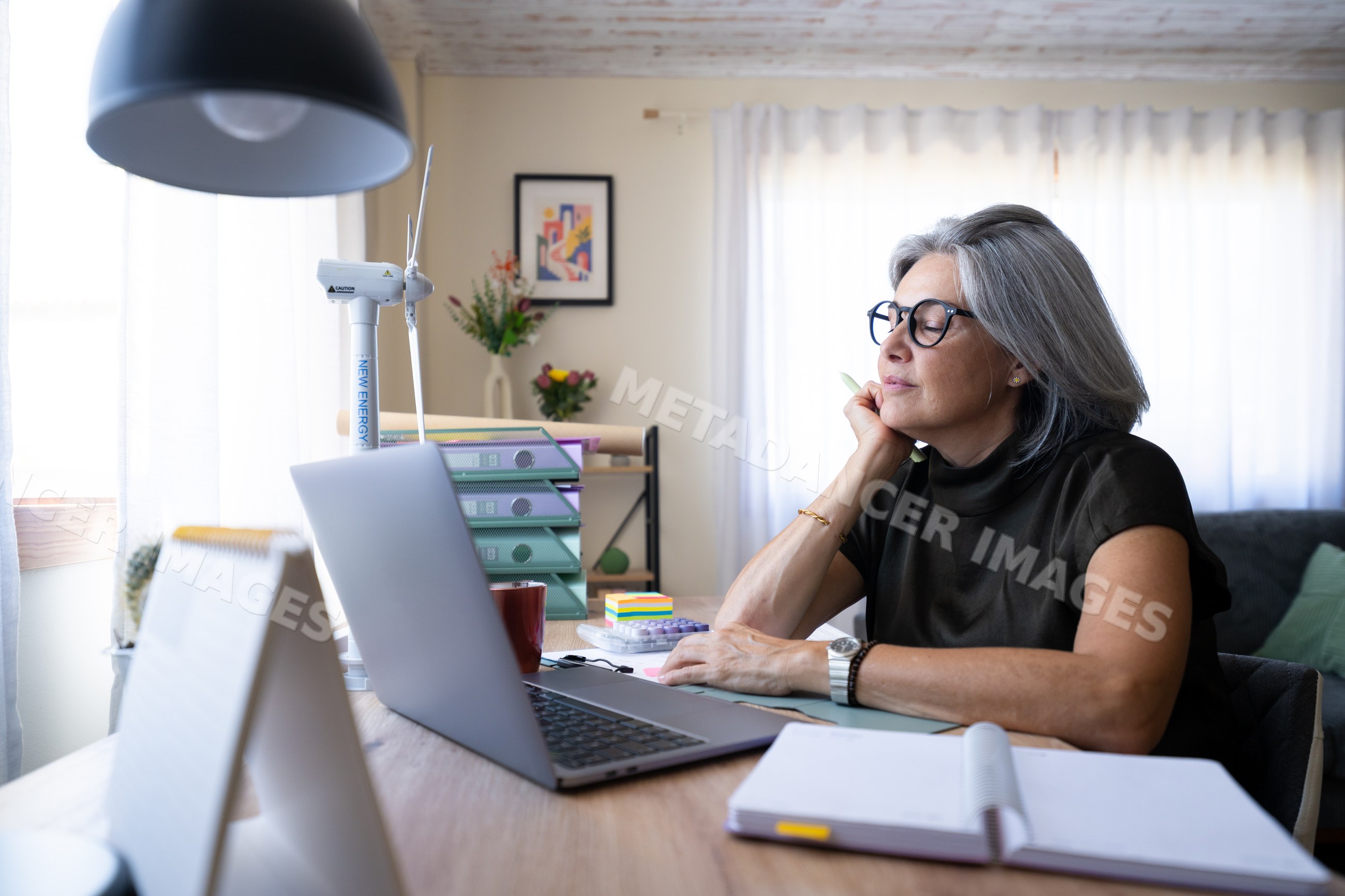 White woman with gray hair working