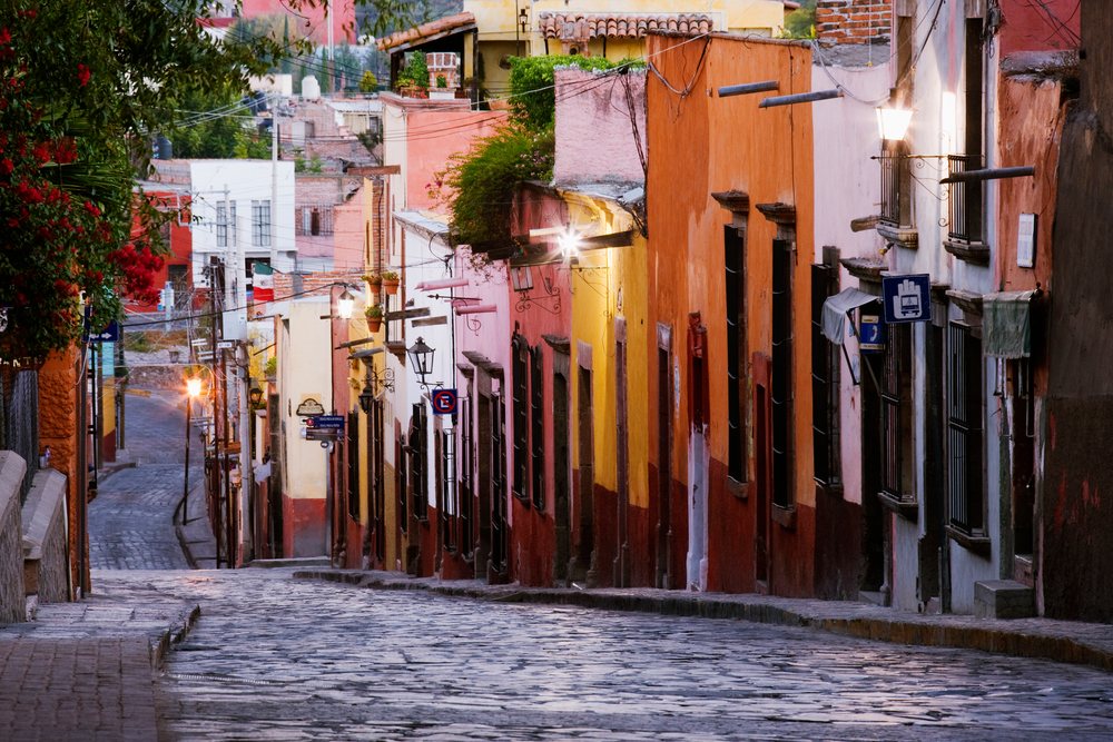 Cobblestone street with colorful buildings mexico