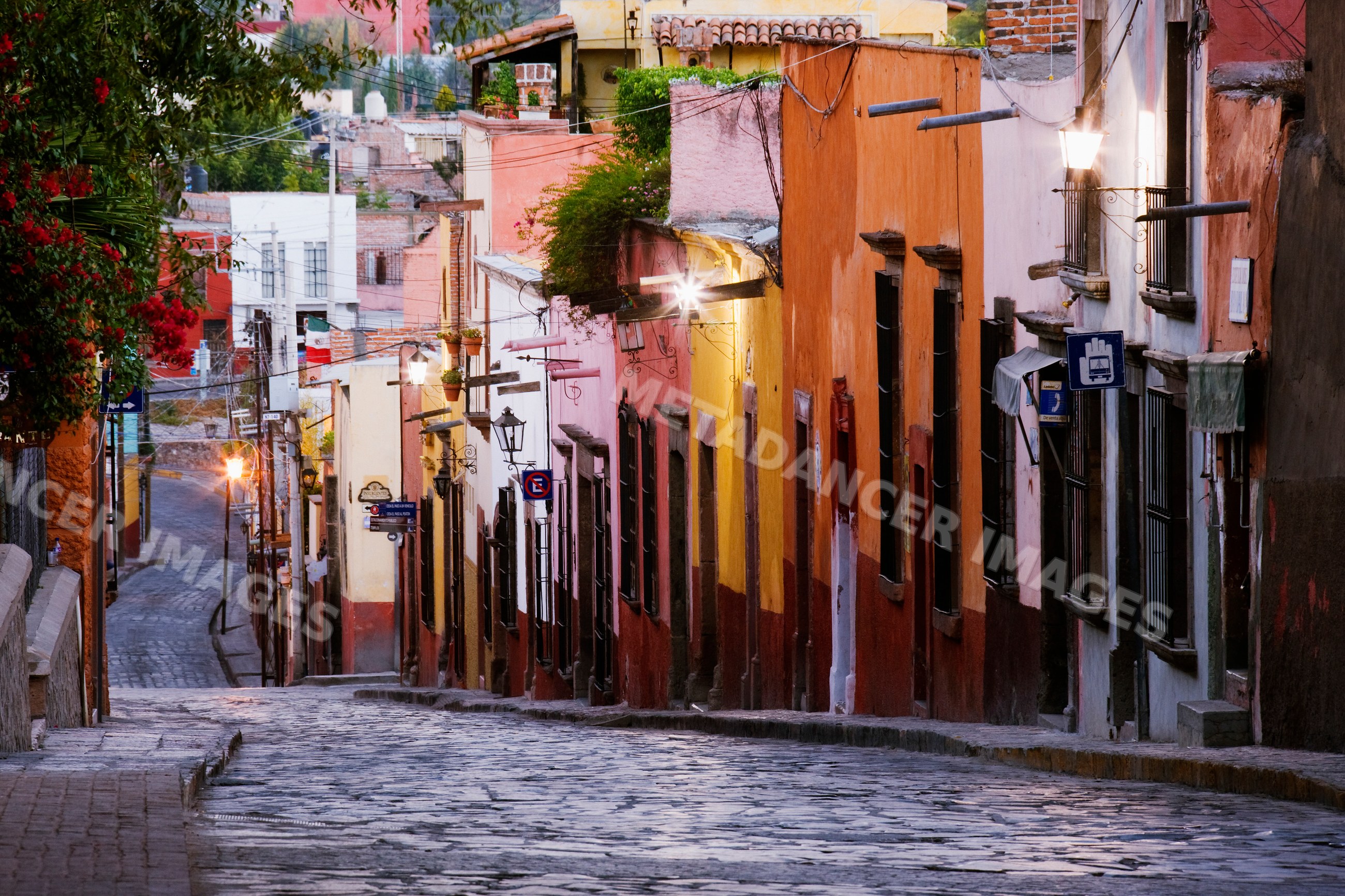 Cobblestone street with colorful buildings mexico