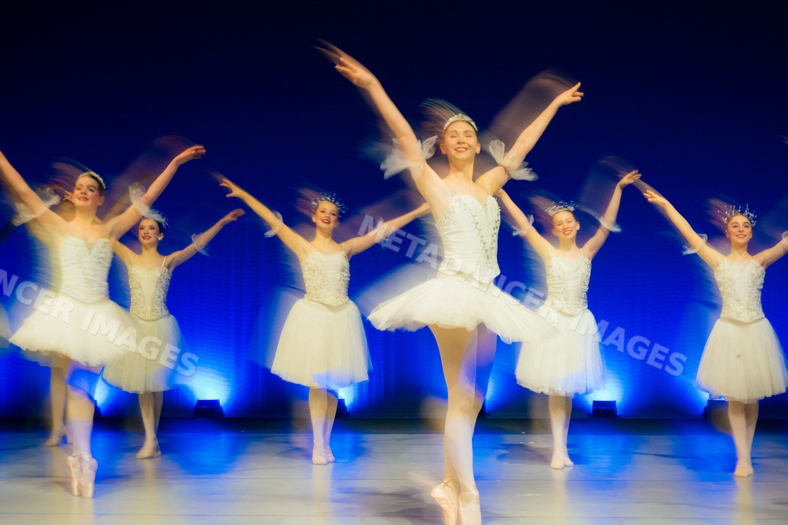 Ballet dancers perform a classical holiday ballet on stage