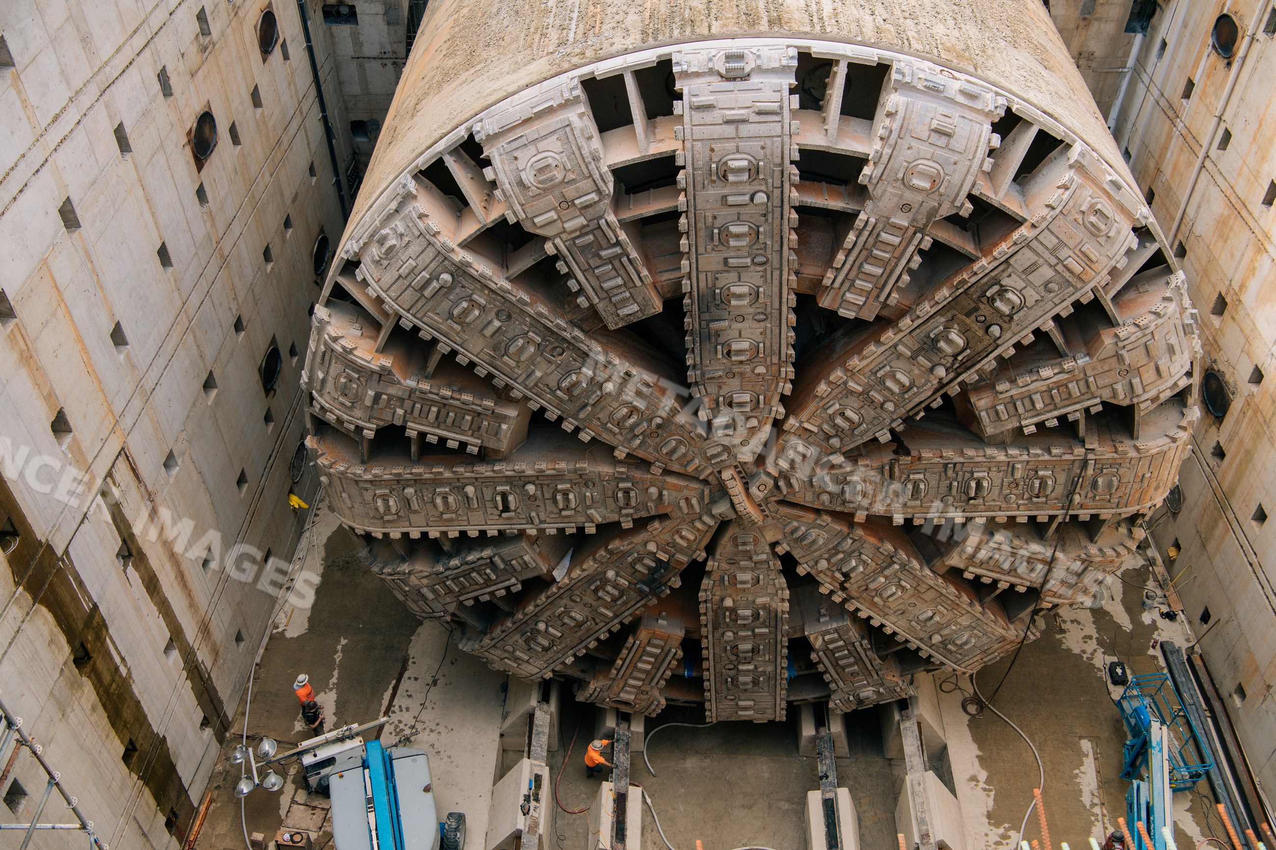 Large tunnel boring machine inside concrete construction site