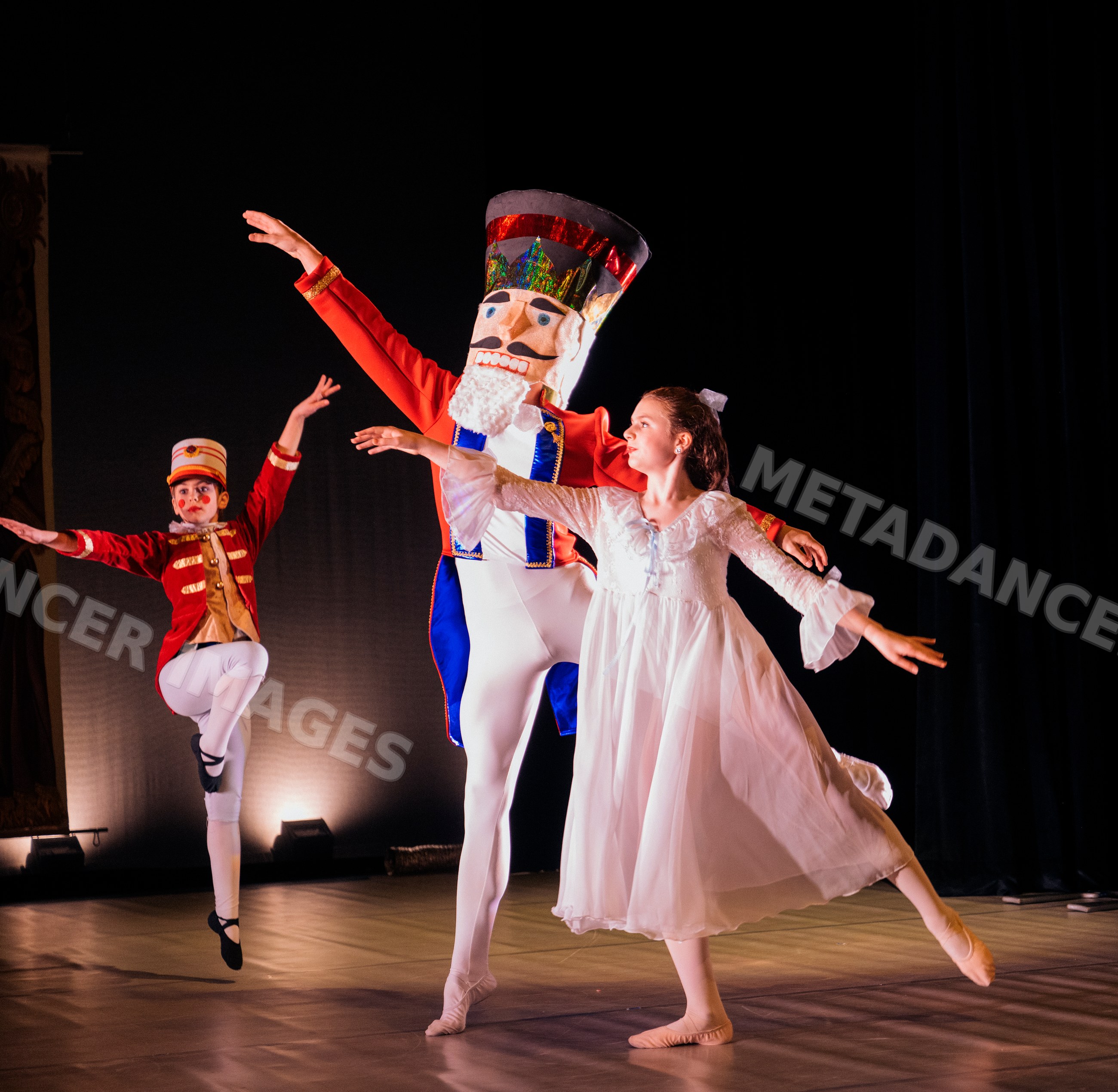 Dancers perform a holiday ballet on stage