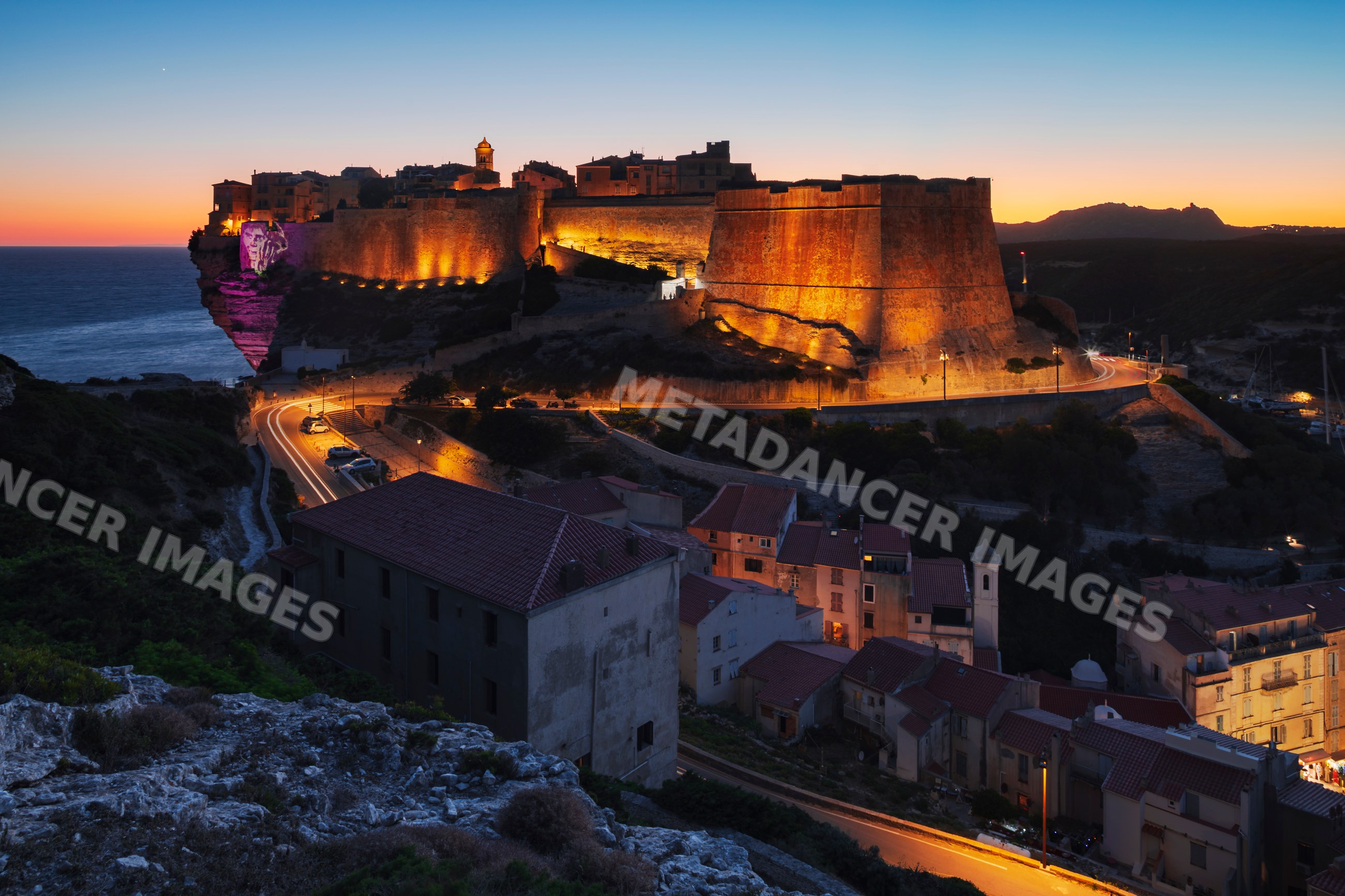 Citadel of Bonifacio illuminated at Dusk on cliff