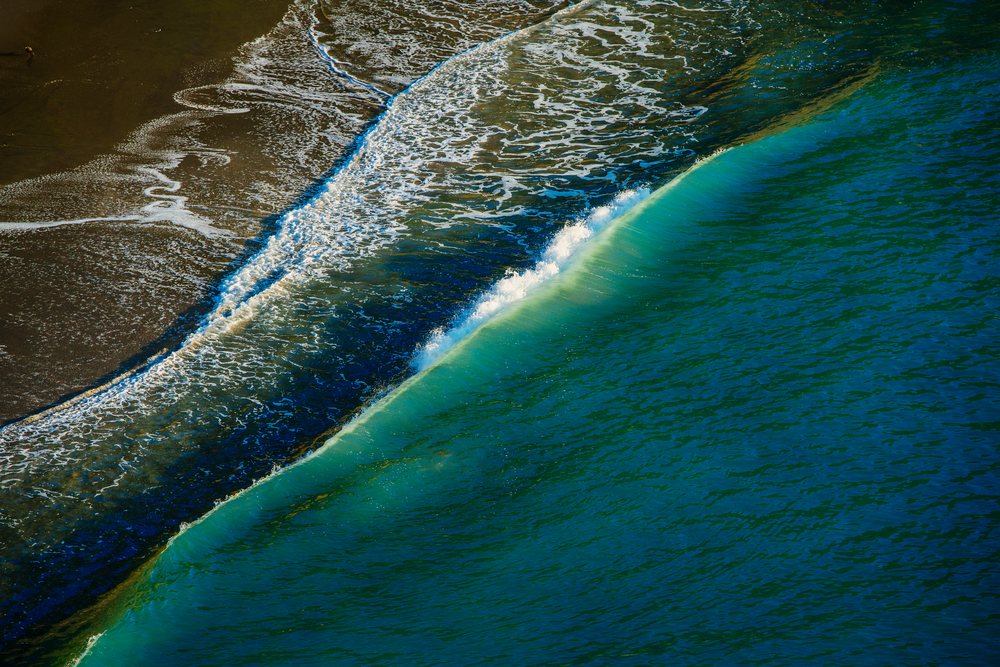 Ocean wave breaking onto shoreline, Oregon