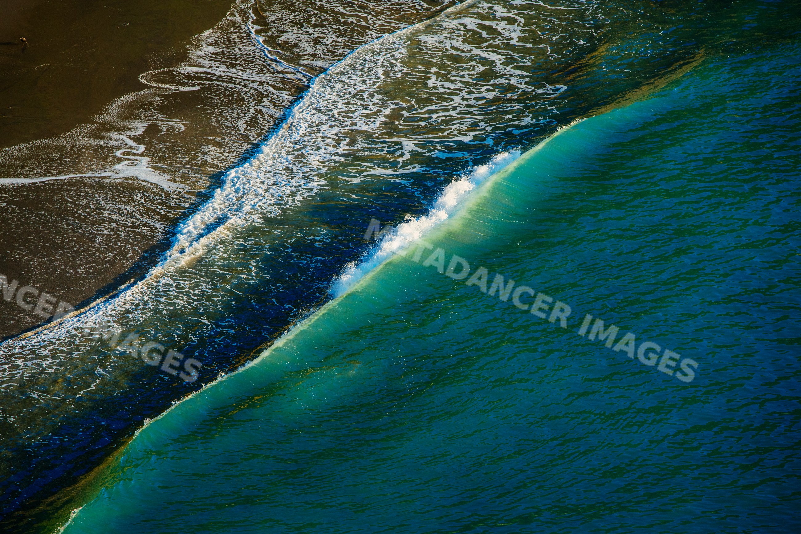 Ocean wave breaking onto shoreline, Oregon