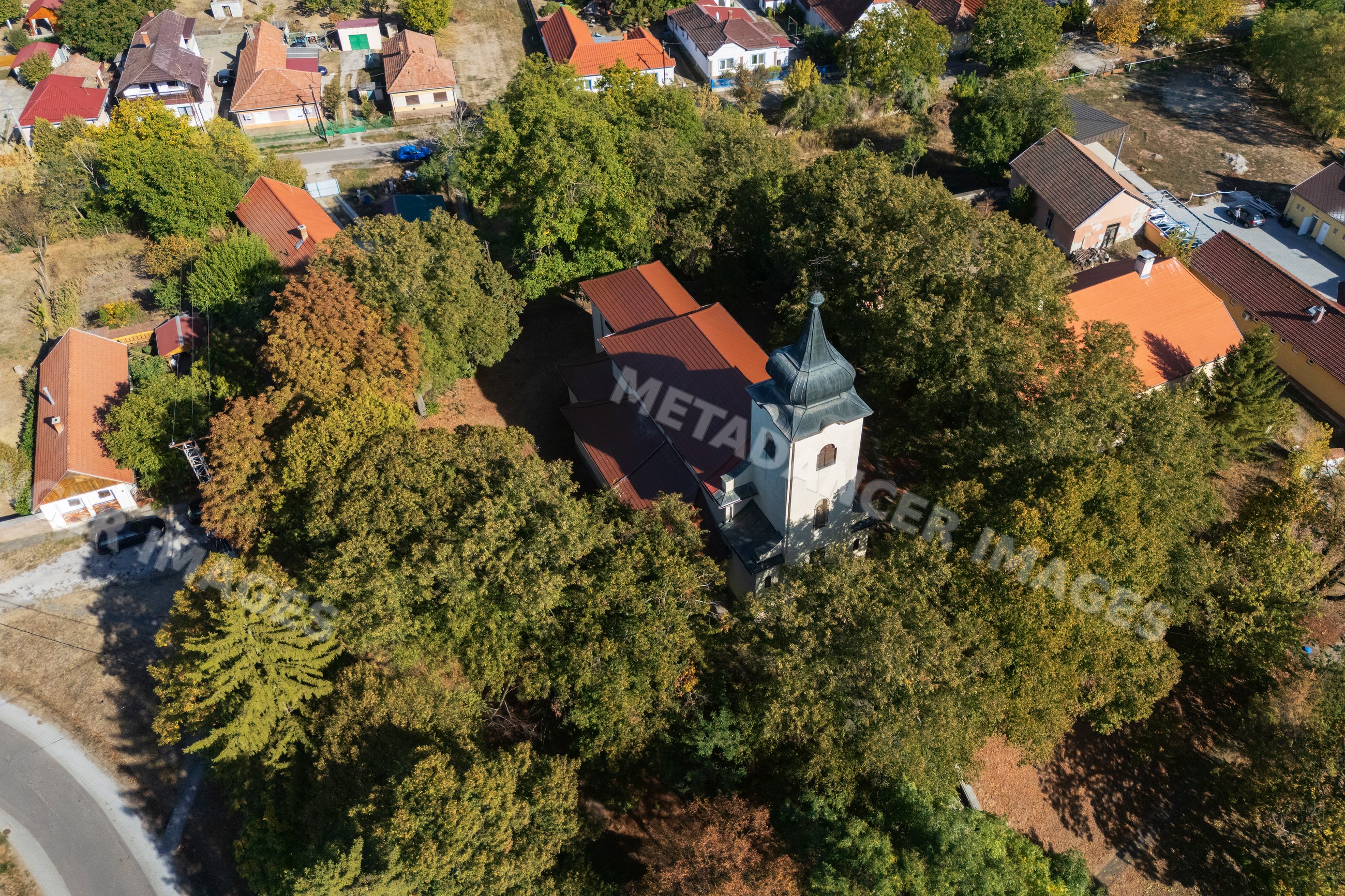 Our lady of Hungary roman catholic church surrounded by trees in novaj